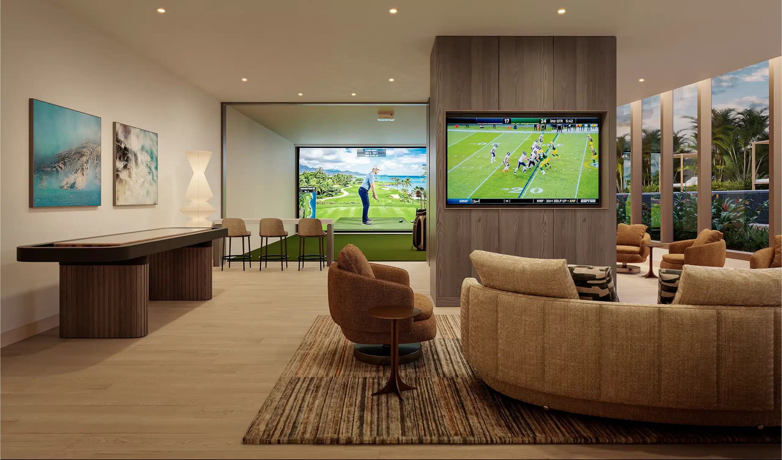 Modern lounge with curved sofa, TV showing football, bar seating, golf simulator, shuffleboard table, large windows, and tropical outdoor view.