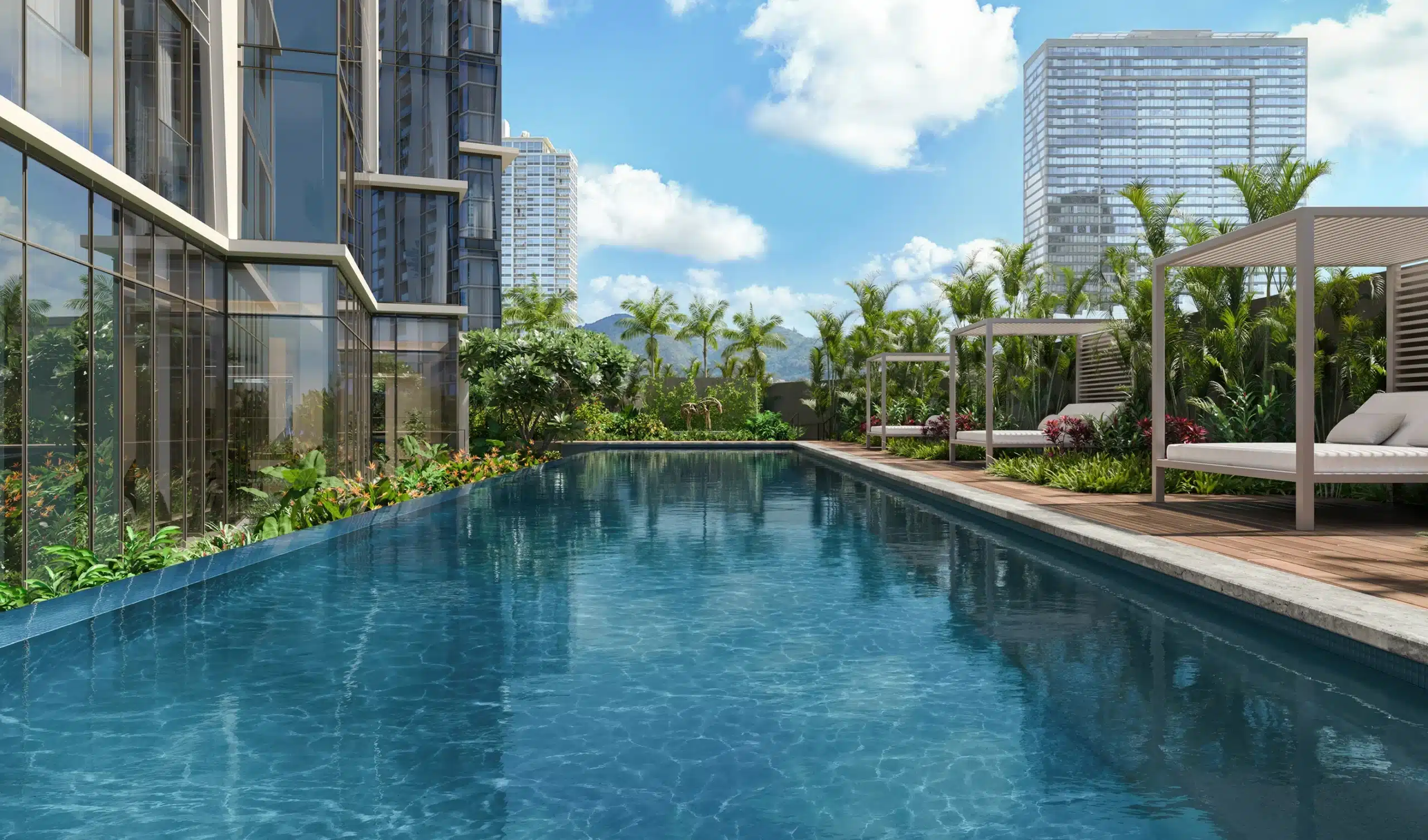 Rectangular outdoor swimming pool beside a modern building, surrounded by palm trees, lounge chairs, and high-rise towers under a bright, partly cloudy sky.