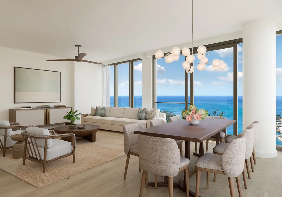 Modern living and dining area with neutral decor, large windows, ocean view, beige sofa, wooden table, upholstered chairs, and a contemporary chandelier.