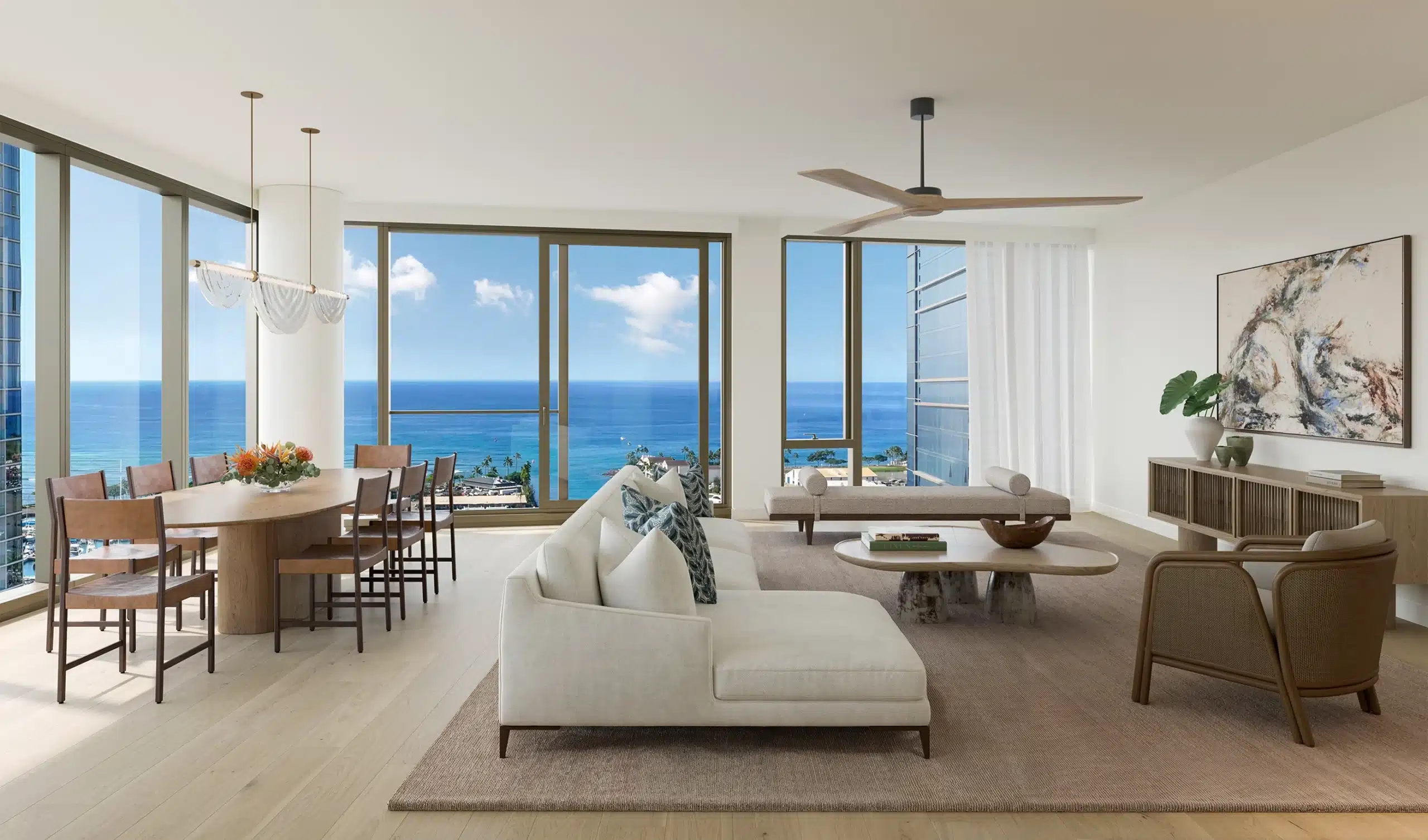 Modern living and dining area with ocean views, large windows, light wood floors, white walls, and contemporary furniture in neutral tones.