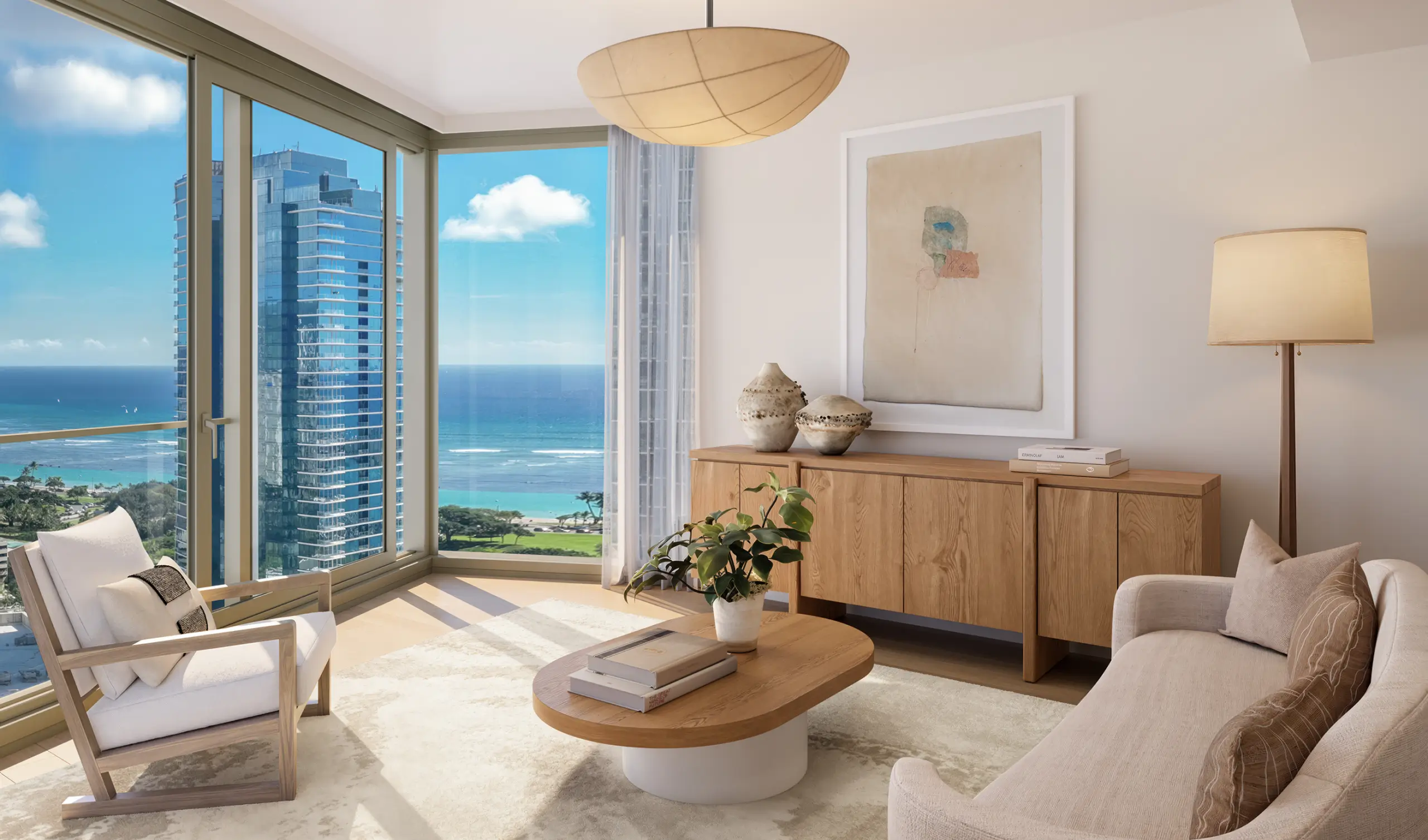 Bright modern living room with large windows, ocean view, wooden furniture, neutral decor, a potted plant on a coffee table, and artwork on the wall.