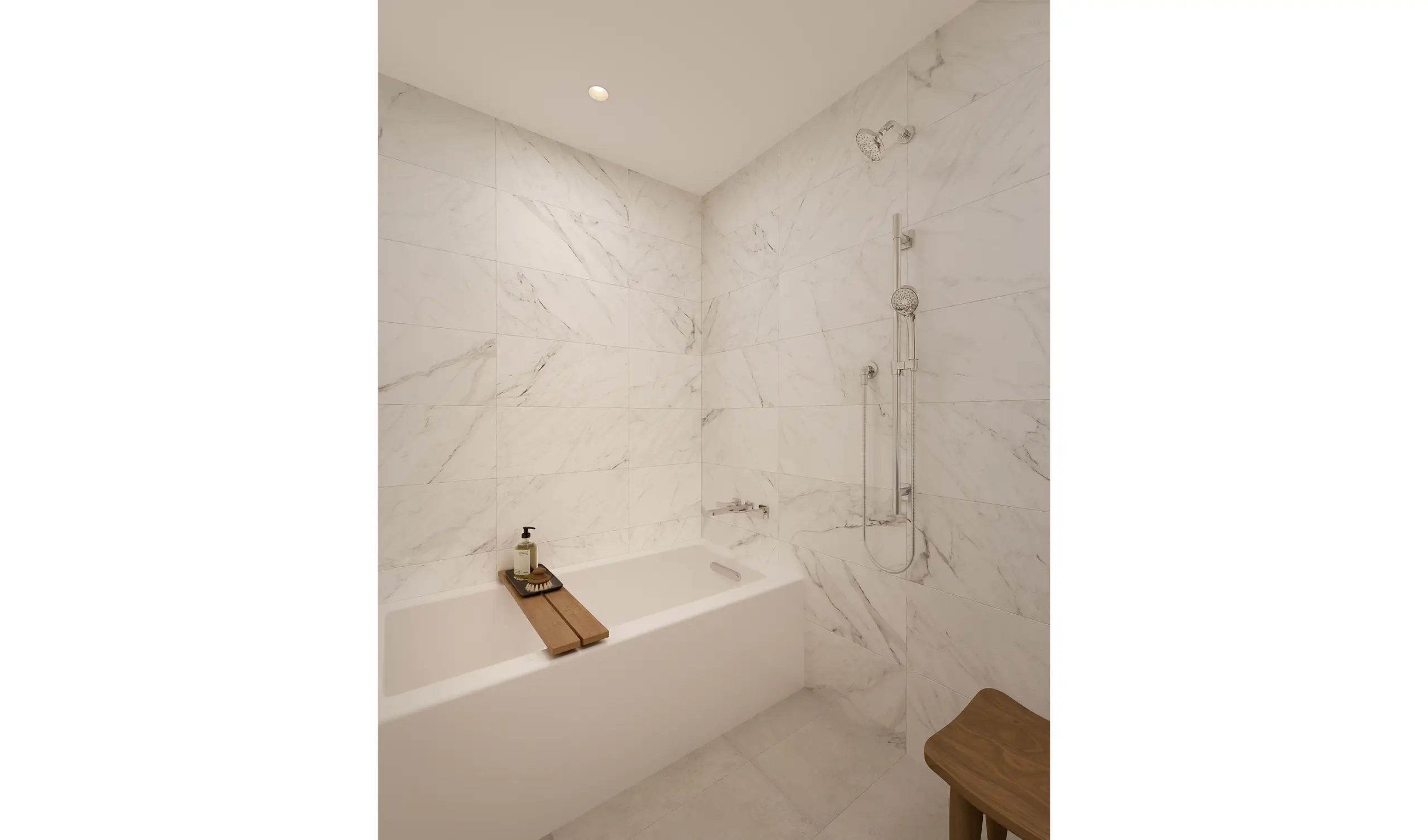 Modern bathroom with white marble walls, built-in bathtub, wall-mounted showerhead, wooden bath tray with soap dispenser, and a wooden stool in the corner.